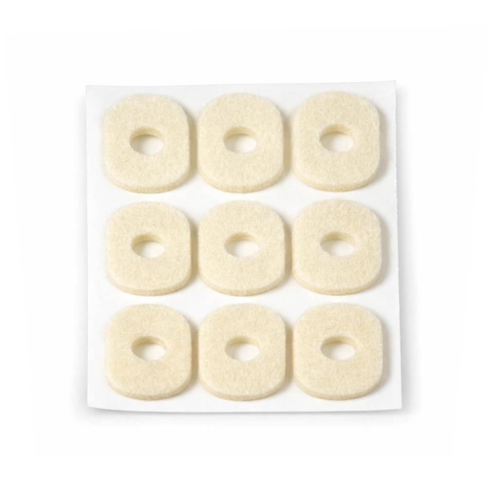 Felt oval foot corn pads with central pressure relief opening on backing sheet