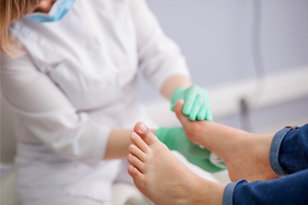 Podiatrist Examining Feet